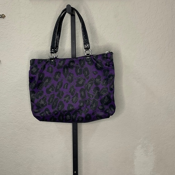 Coach Handbags - Coach Black and Purple EUC Animal Print Tote, small cracks on handles.